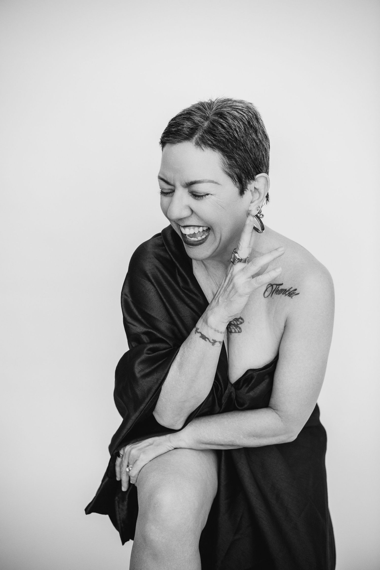 Candid black and white portraits capturing genuine laughter and emotion.