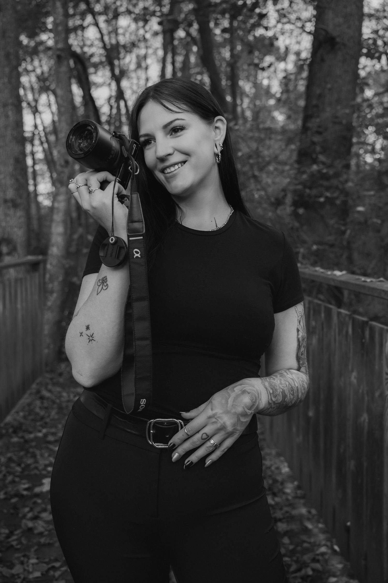 Artistic black and white portraits showing expressive hand gestures against forest backdrop.