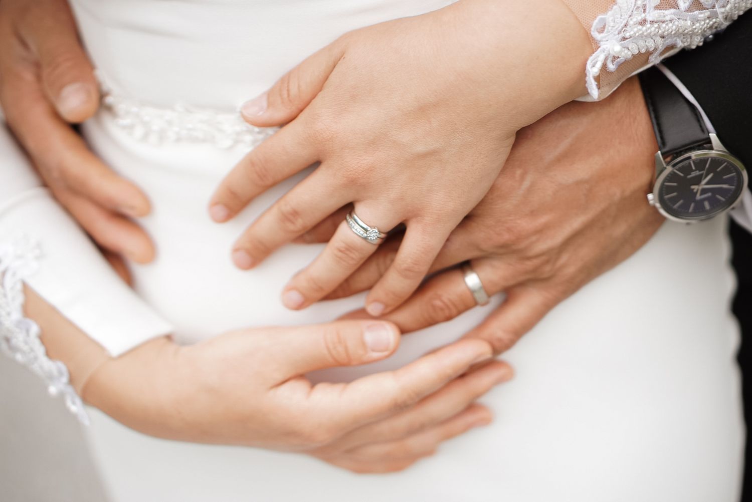 Close-up shots of wedding rings and hands showing intricate details and jewelry.
