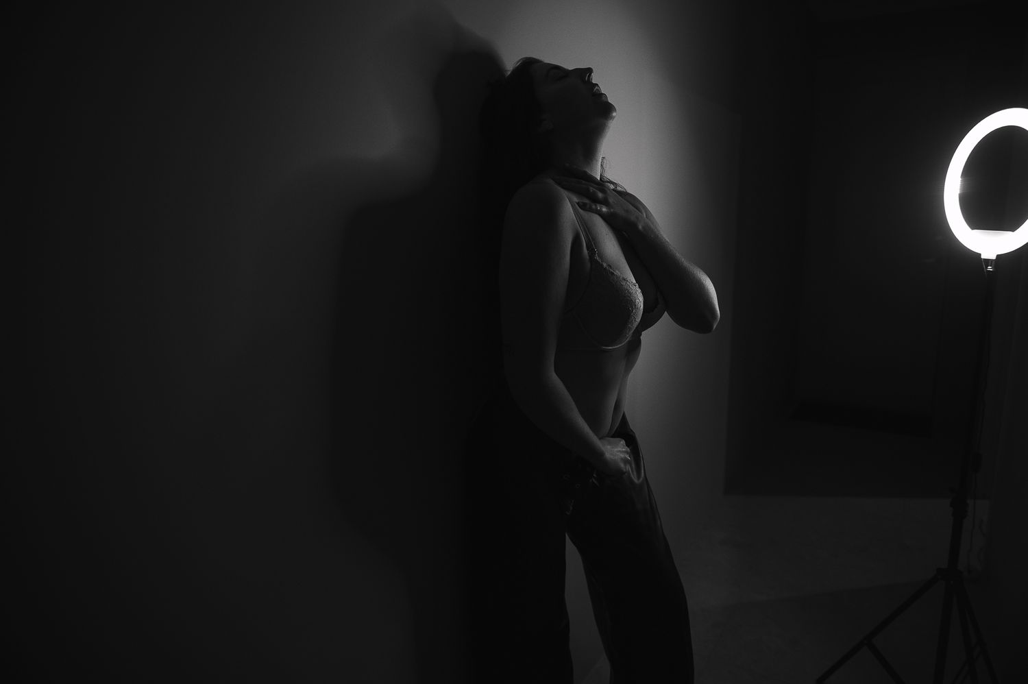 A series of dark, moody black and white photographs of woman arranged in a horizontal filmstrip format. SeduXion Studio Mandurah WA