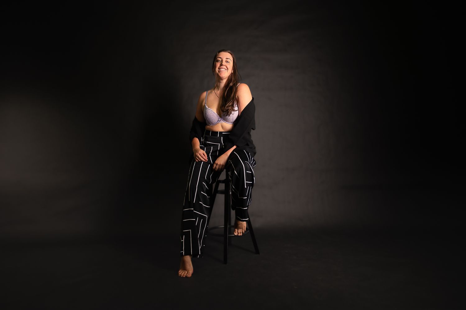 Mandurah Boudoir Photographer, Paige, posing for business headshots in Studio with black background. SeduXion Boudoir Studio.