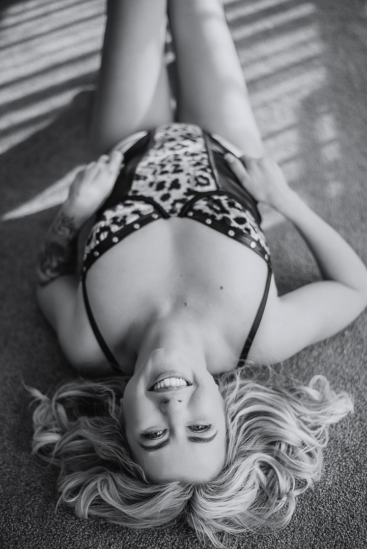 Artistic black and white image of women laying on carpet posing for boudoir photoshoot for SeduXion Studio in Mandurah Western Australia