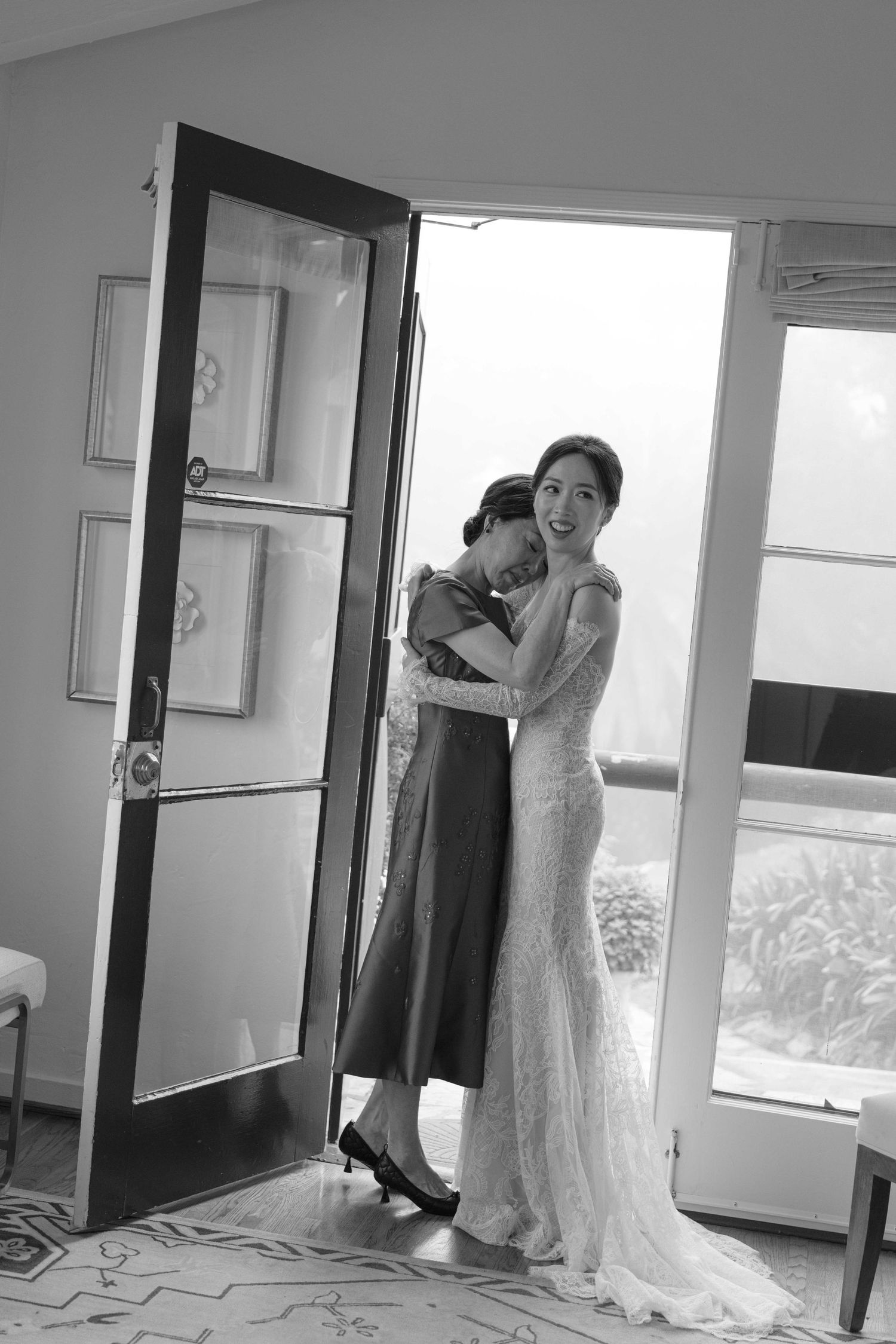 A candid moment during wedding preparations captured in a bright modern space.