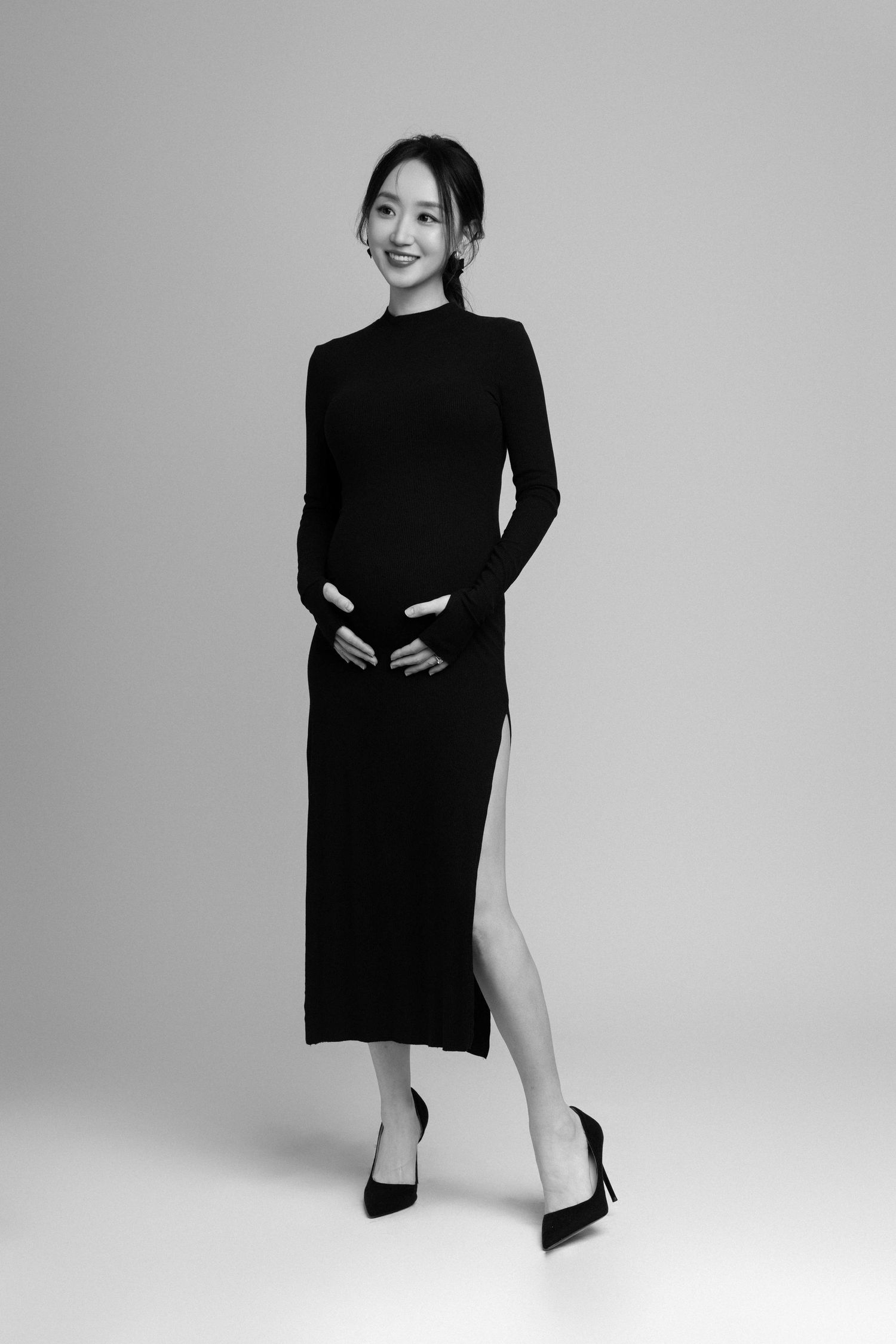 Minimalist black and white fashion series showcasing poses in sleek black attire.