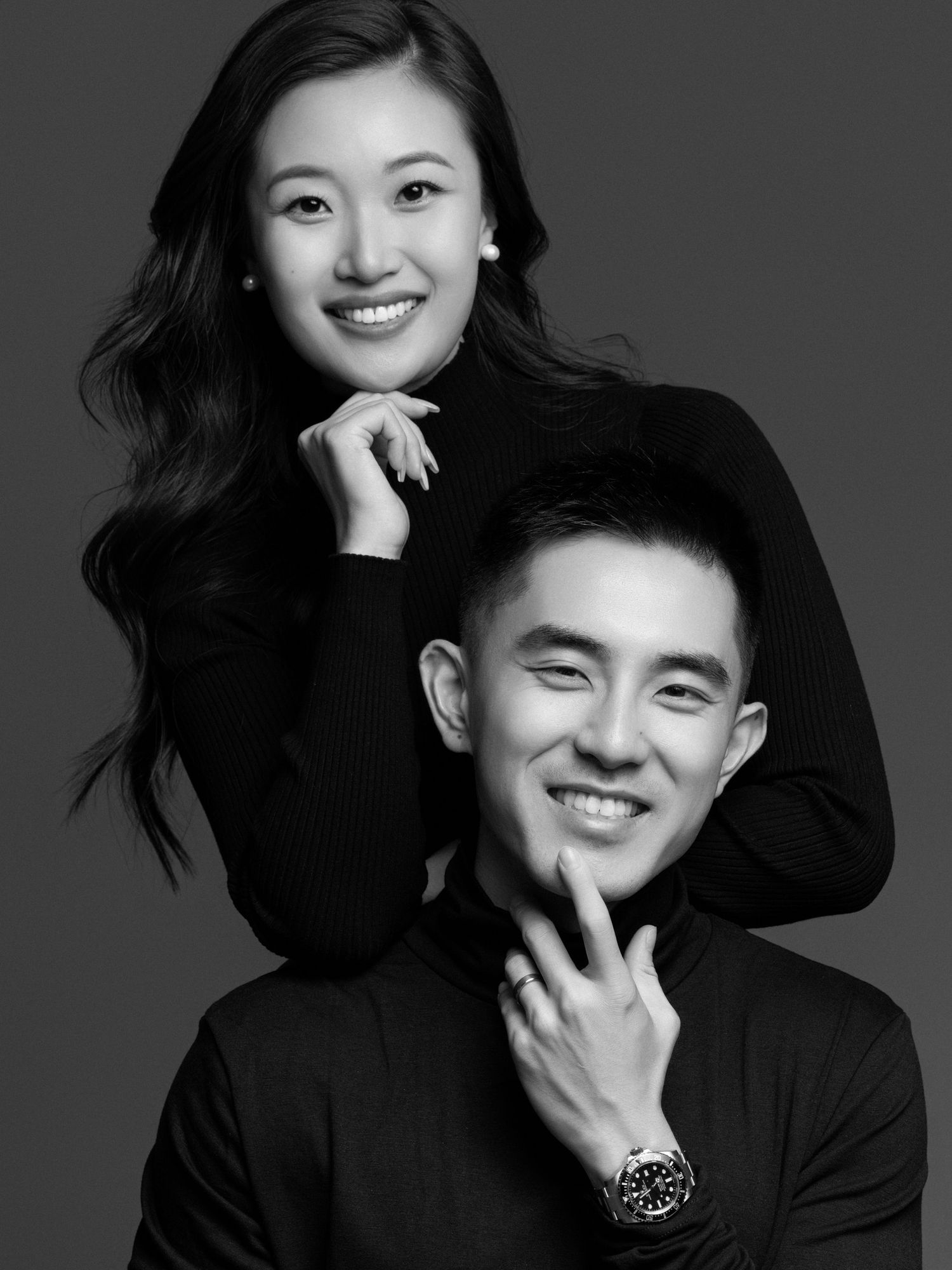 Artistic black and white photo series capturing joyful expressions in dark attire.