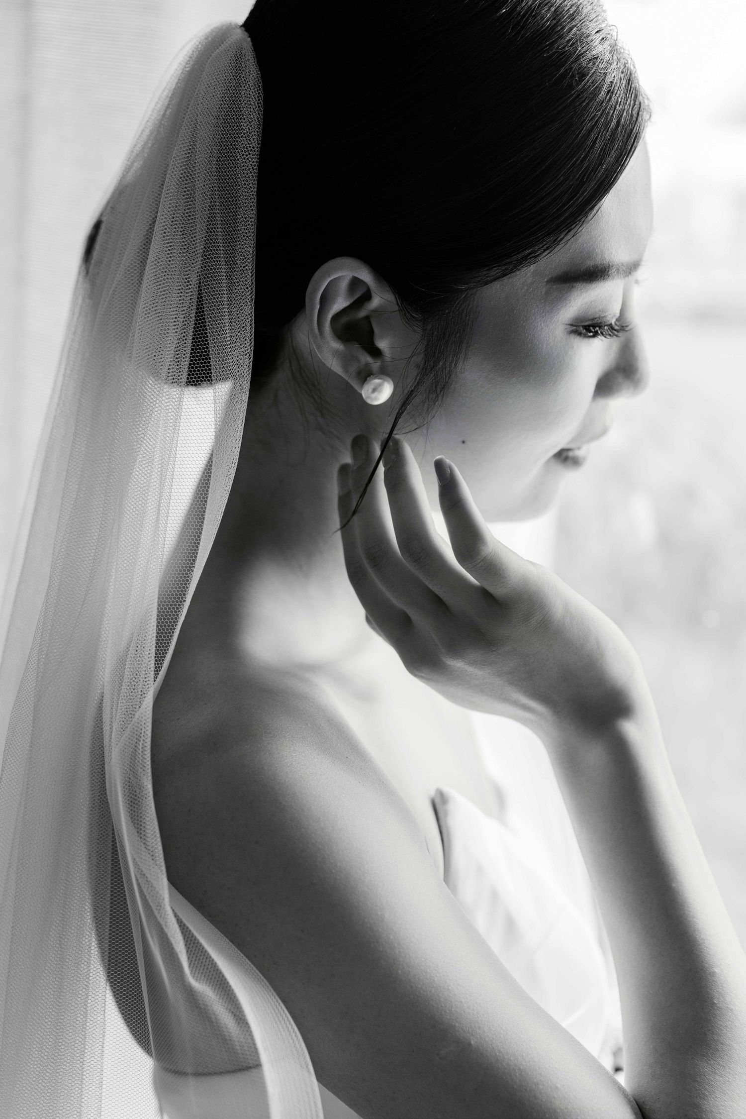 Artistic black and white profile shots of elegant bridal details.