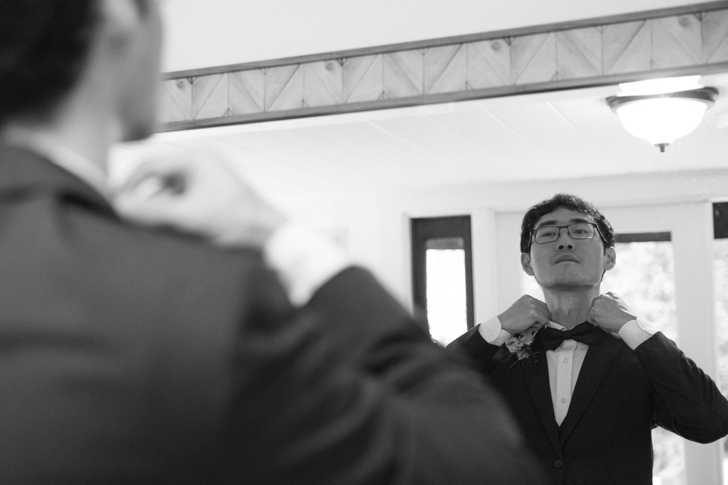 Wedding party members celebrate with joyful expressions during an indoor reception.