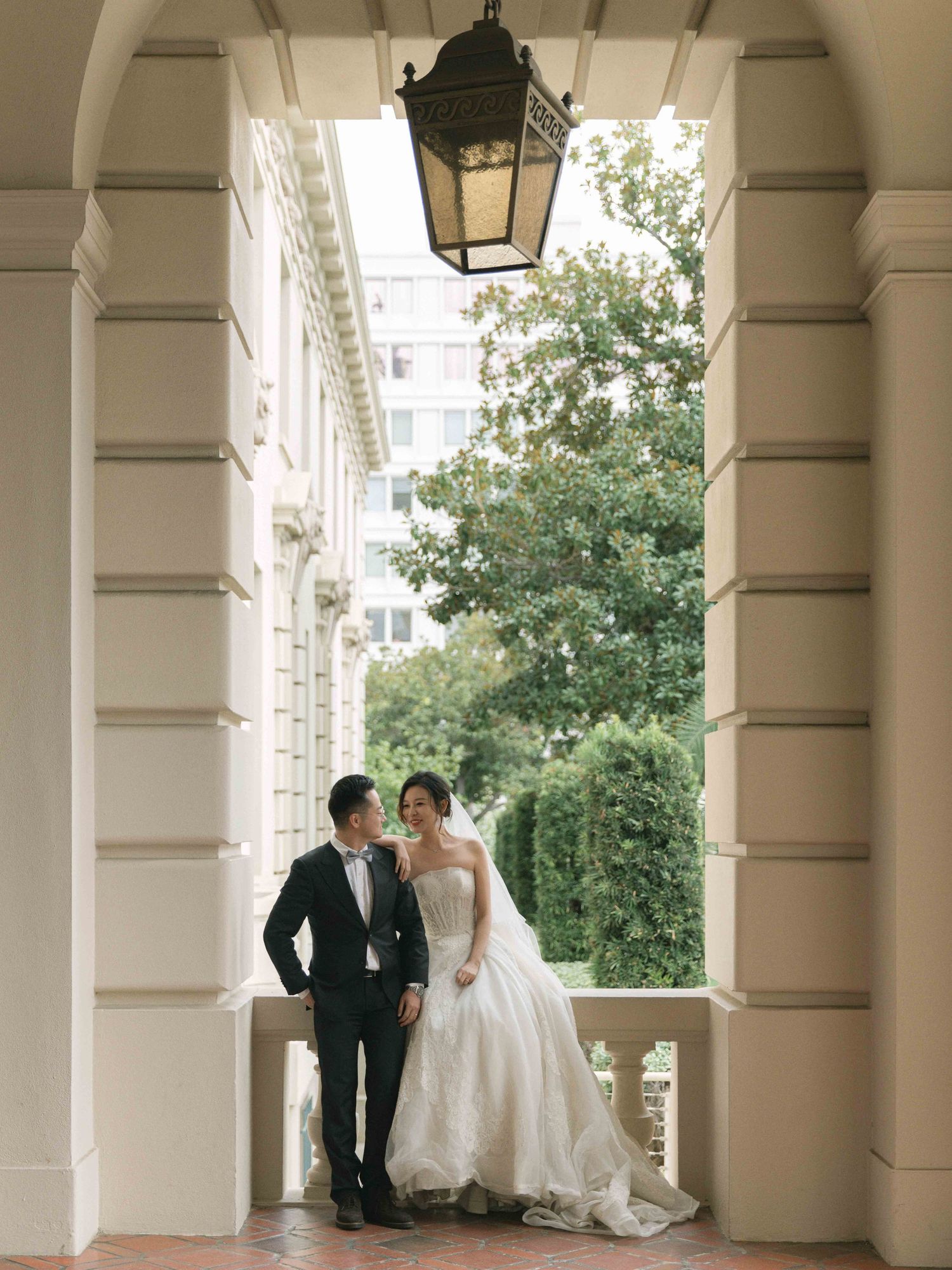 Elegant wedding venue with white columns and archways creating a classic architectural frame.