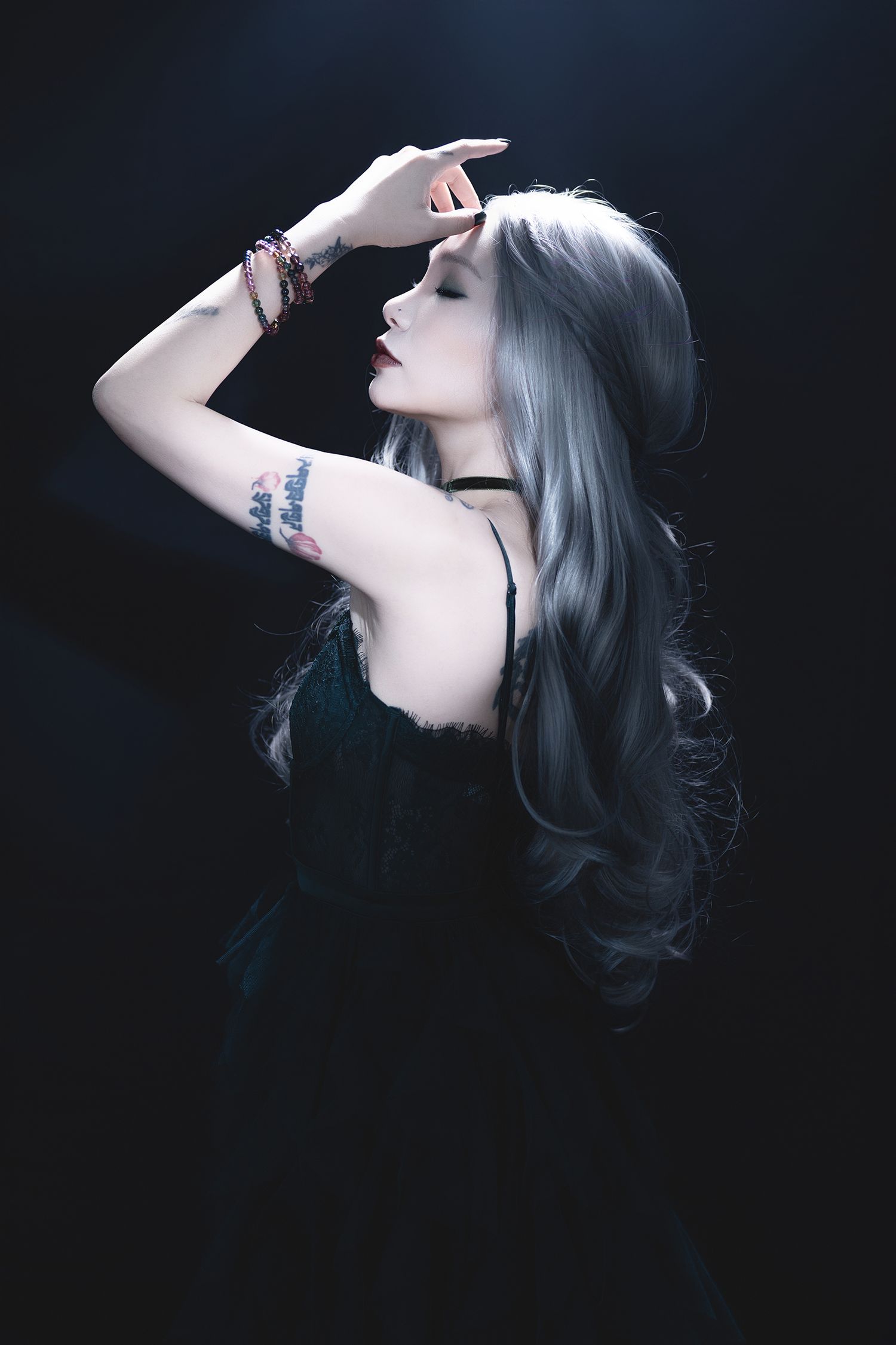 Moody profile portraits featuring silver hair and dark aesthetic styling.