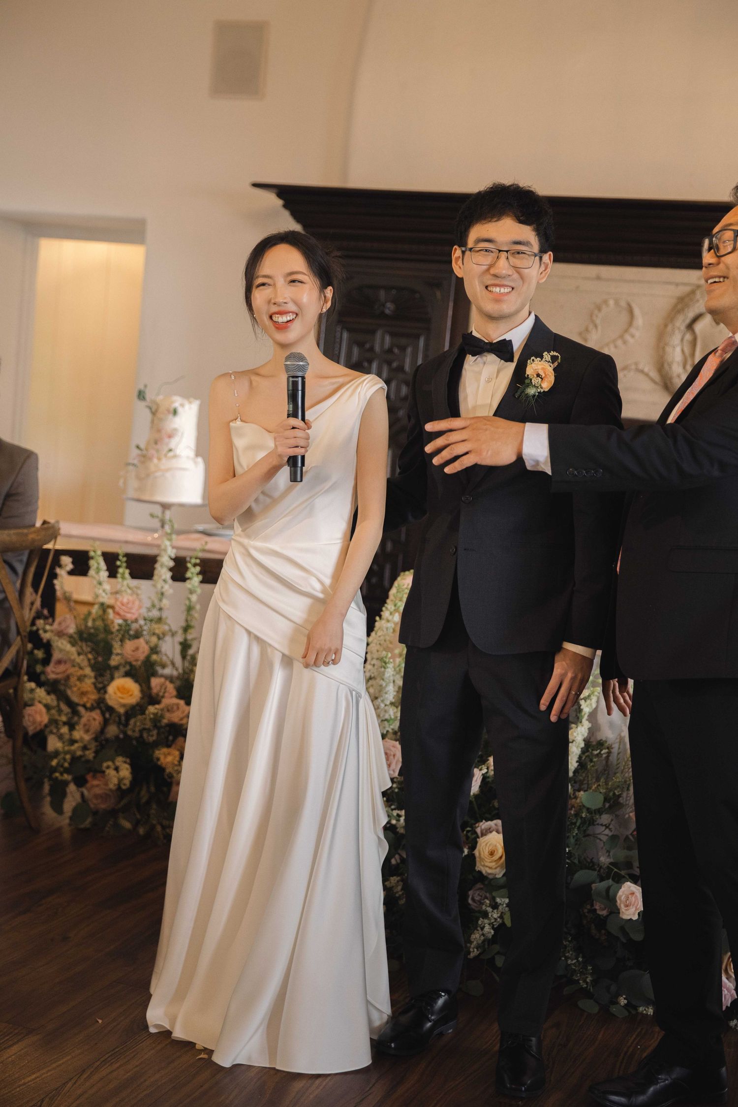 Wedding party celebrating with joyful dance moves at reception.