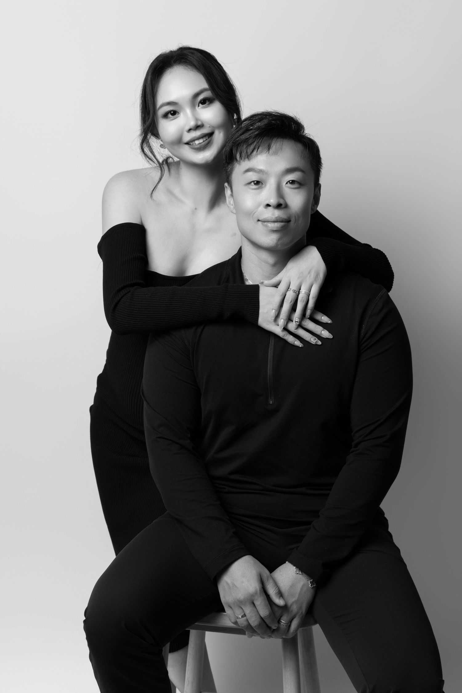 Intimate black and white couple's portrait series in matching dark attire.