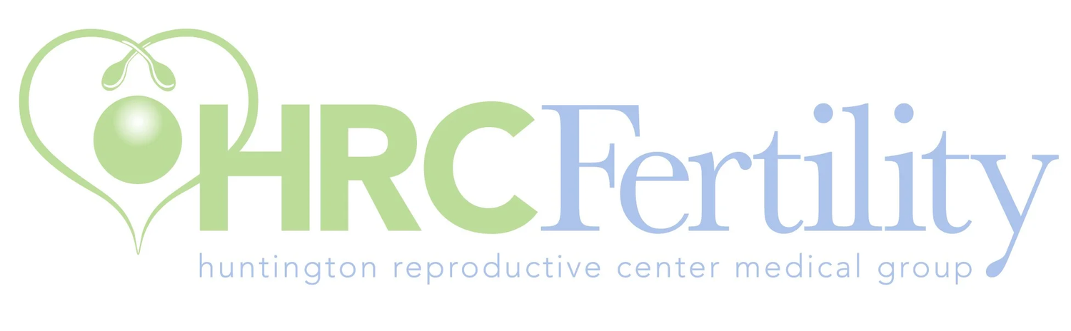 Medical fertility center logo in green and blue colors.