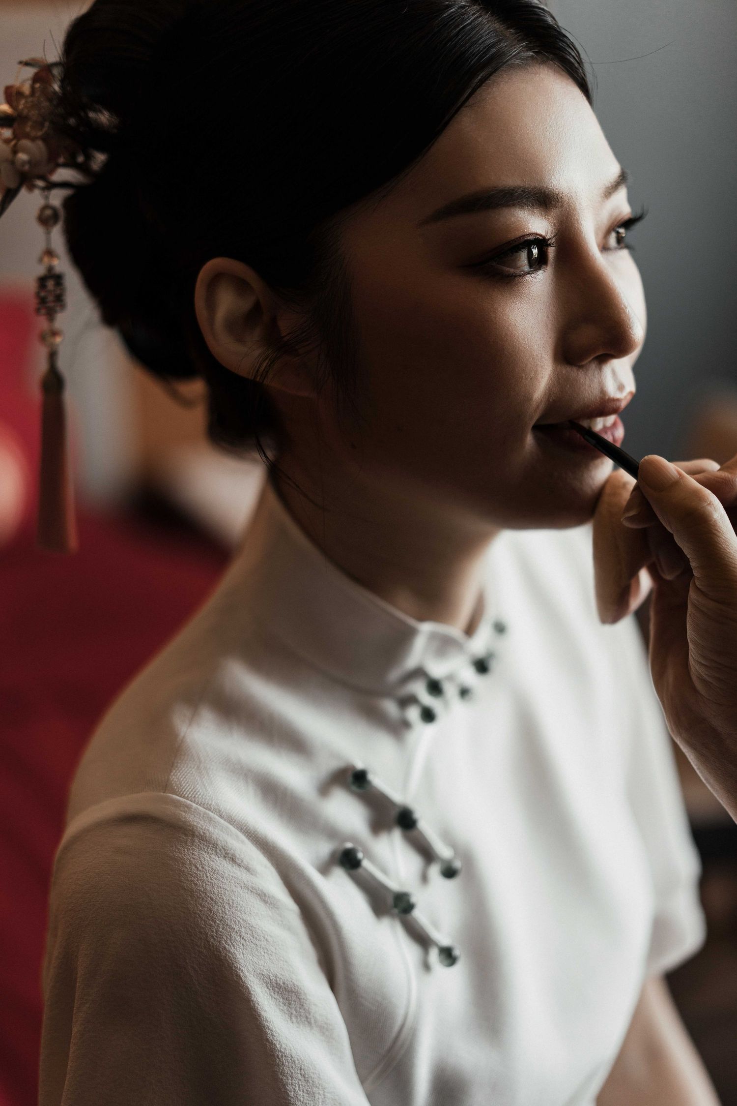 Close-up portrait shots featuring a traditional white cheongsam dress with mandarin collar.
