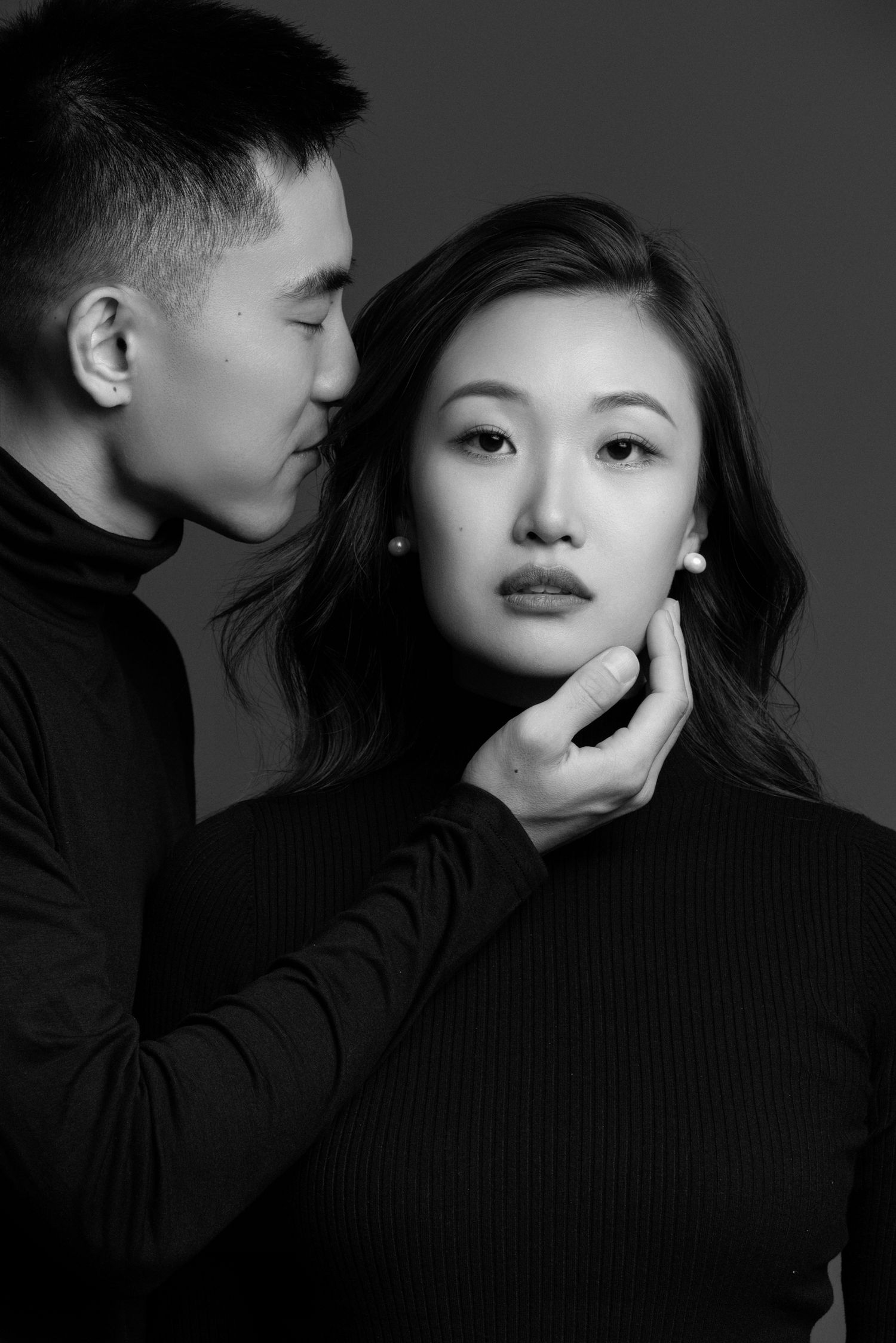 Dramatic black and white portrait series showing intimate artistic poses.