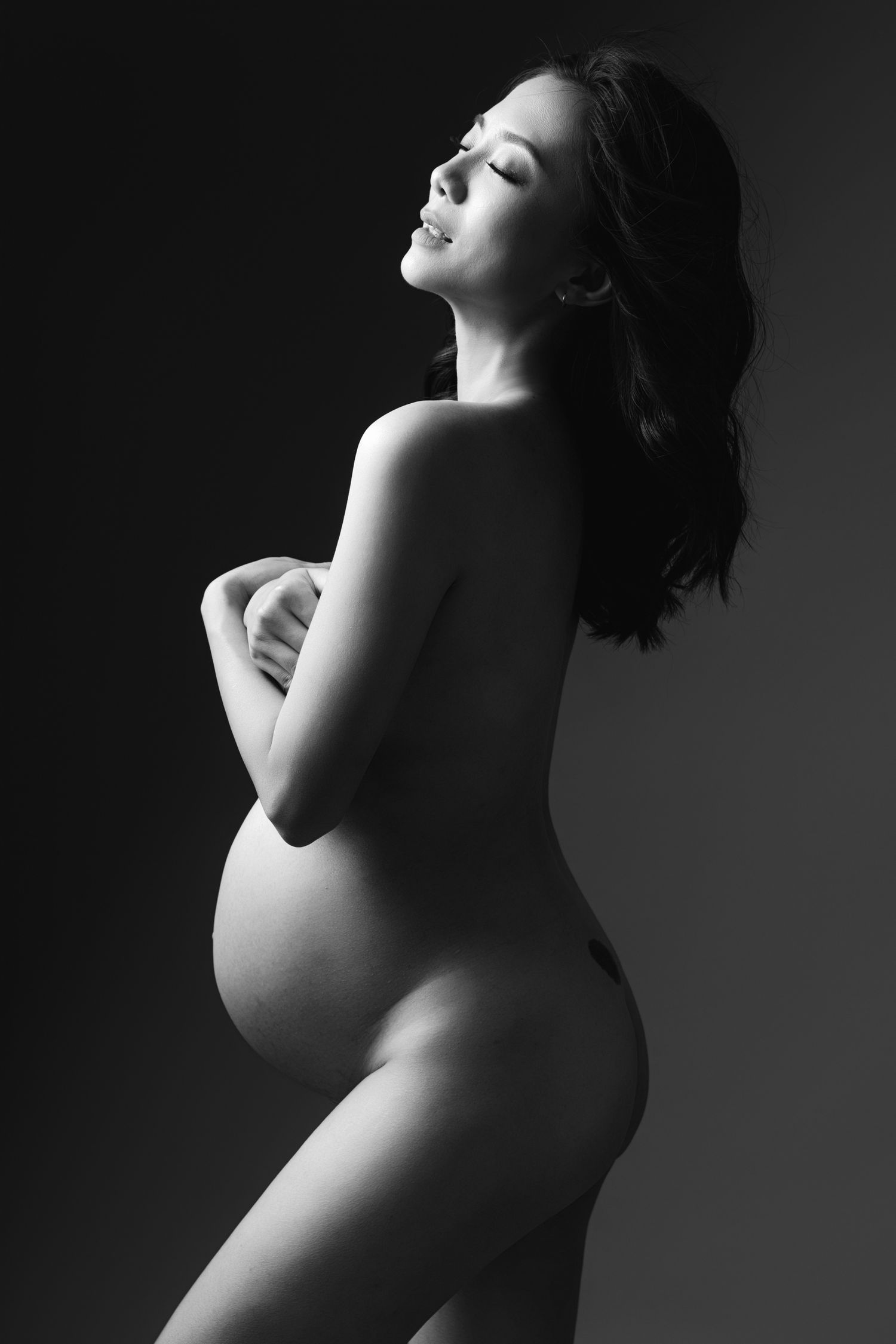 Black and white artistic nude photography series showing silhouetted profile poses with dramatic lighting and shadows.