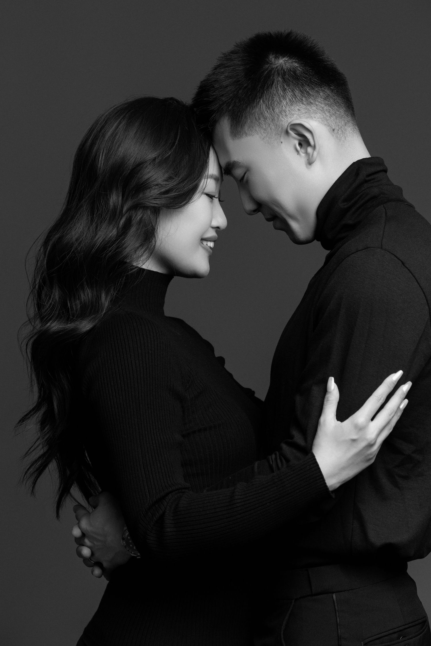 Artistic black and white photo sequence capturing intimate moments between two people.