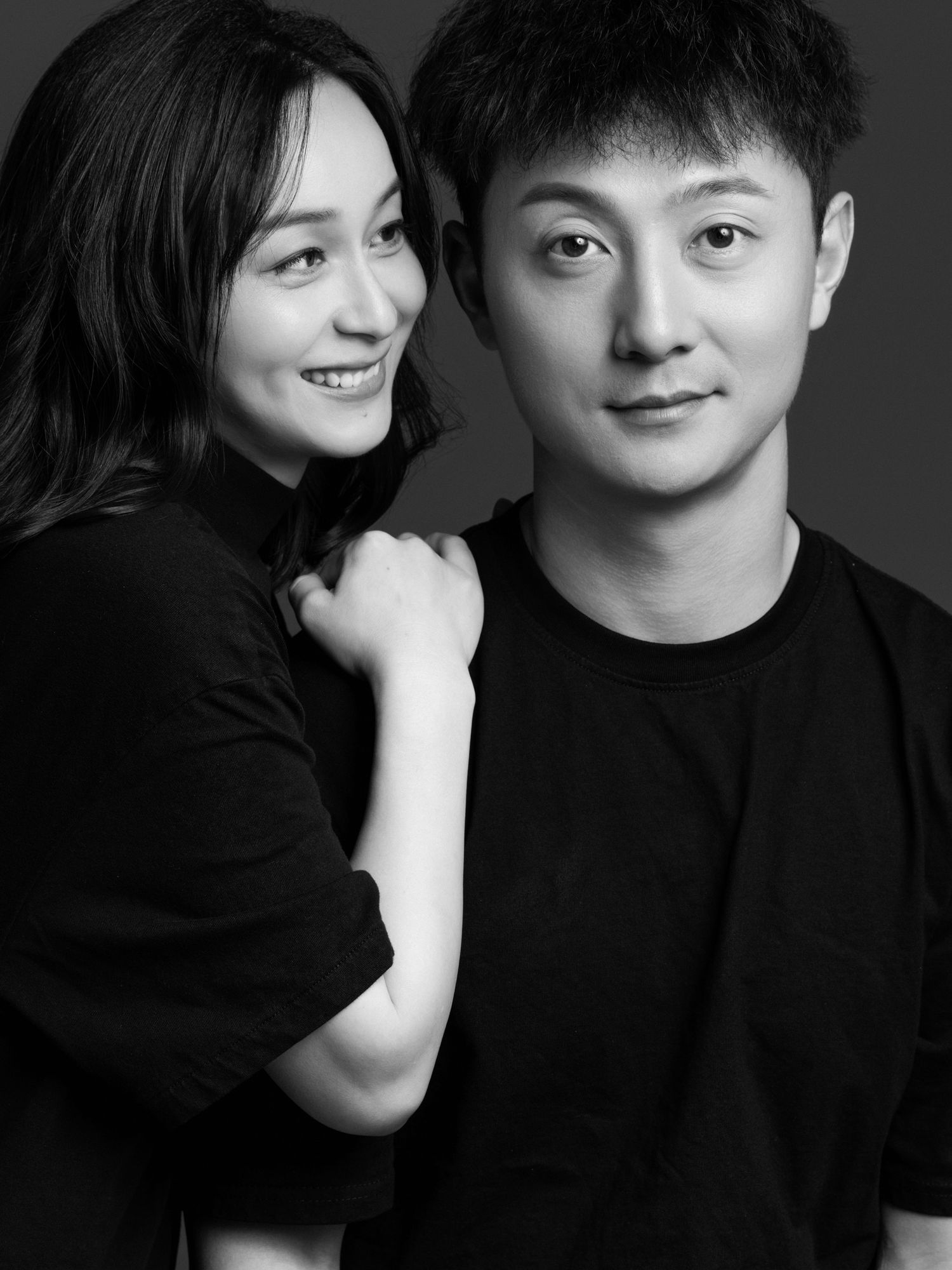 Candid black and white photos showing affectionate moments between couple.