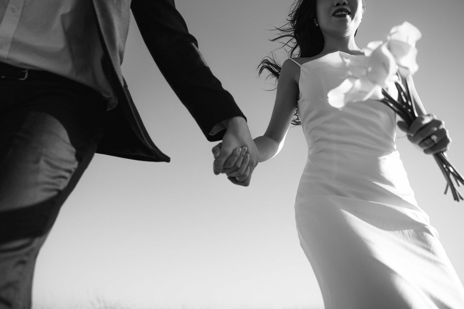 Artistic silhouettes of a couple dancing in dramatic lighting.