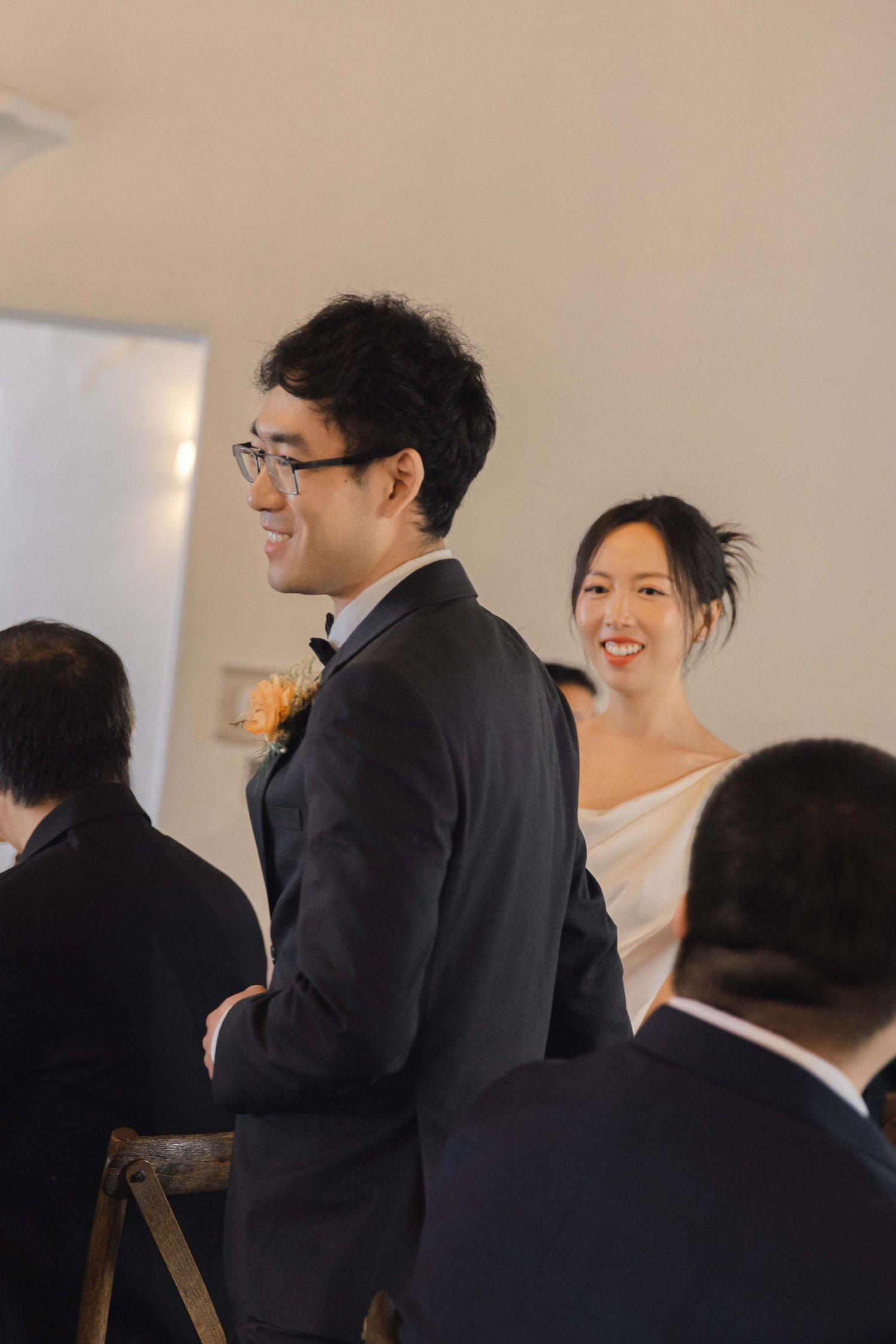 Wedding reception guests enjoying celebrations in an elegant venue.