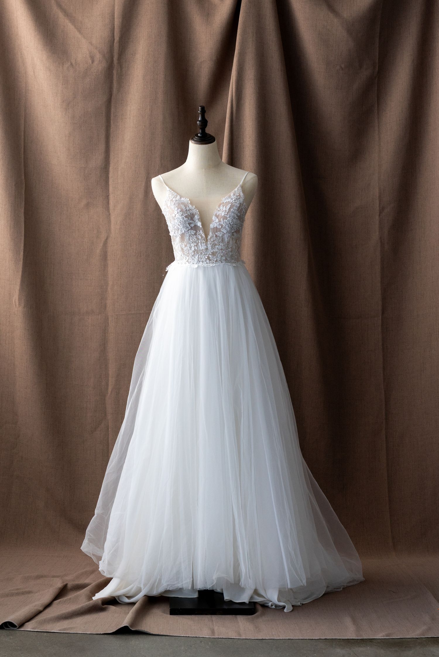 Elegant white tulle ball gown with detailed lace bodice shown from multiple angles.