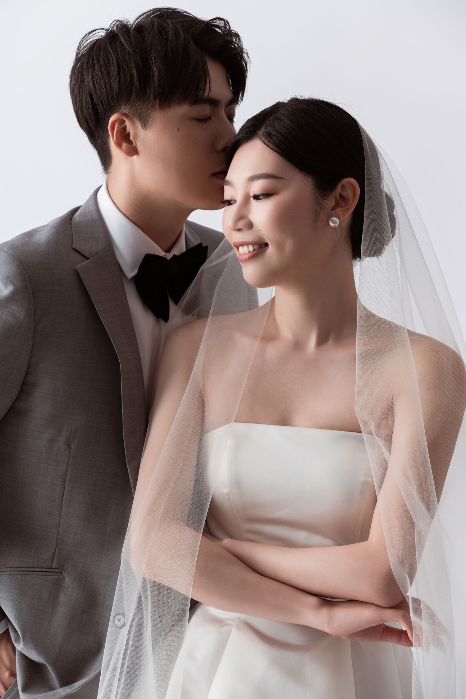 Romantic wedding photography series with soft lighting and intimate poses.