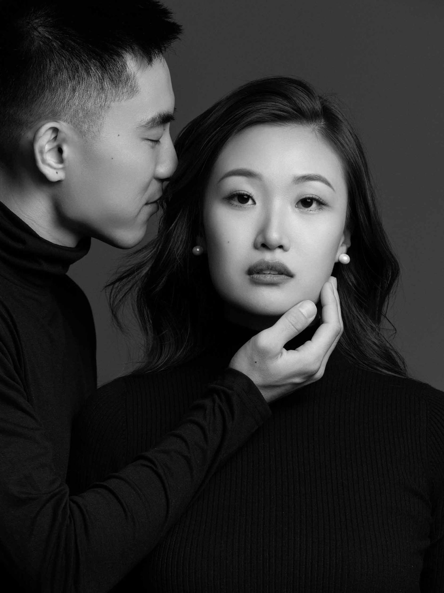 Moody black and white portraits with dramatic lighting and poses.