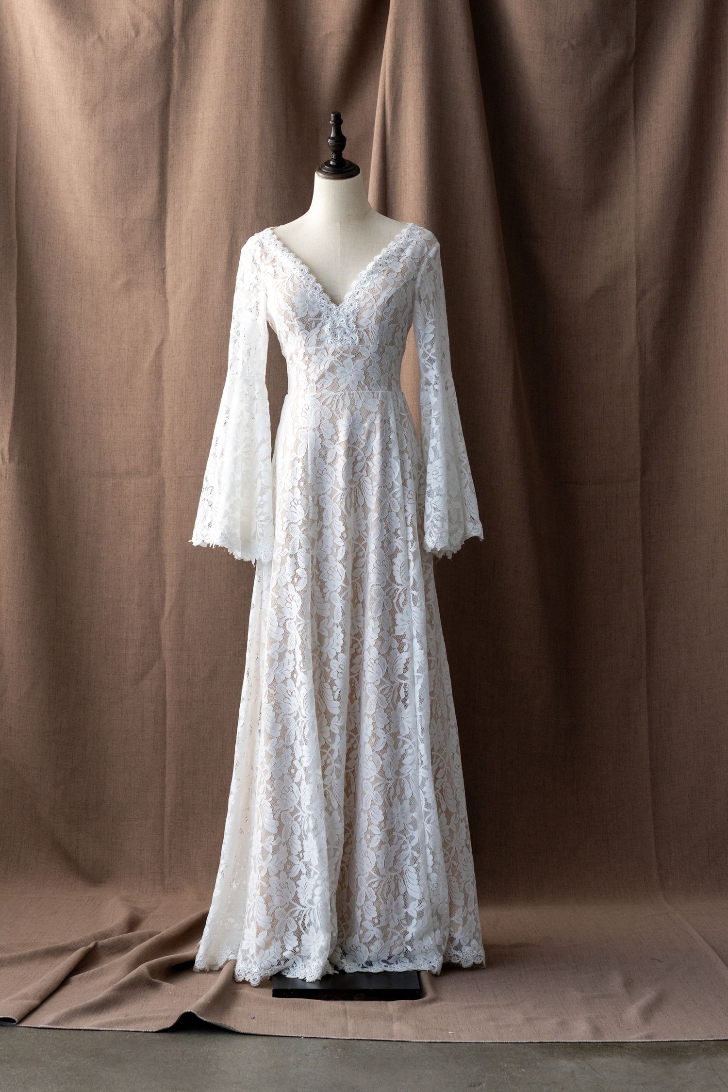 Empire waist lace wedding dress with bell sleeves shown from multiple angles.