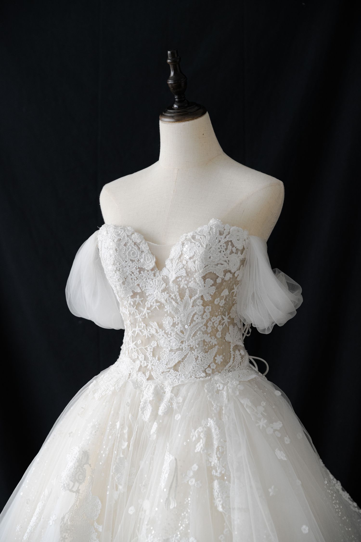 Princess ball gown with off-shoulder sleeves and embellished sweetheart neckline.