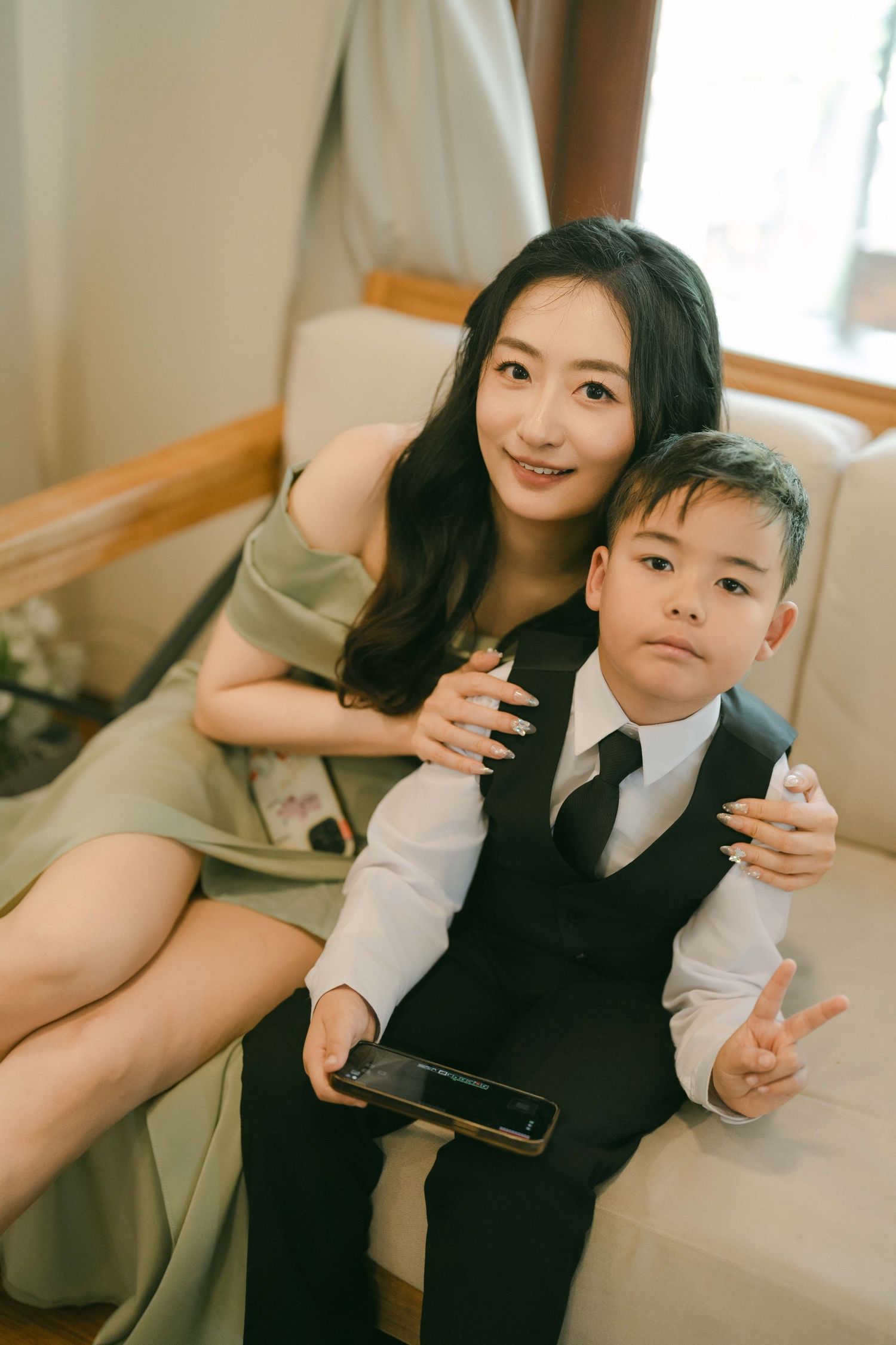 A formal occasion photoshoot in a bright interior setting.