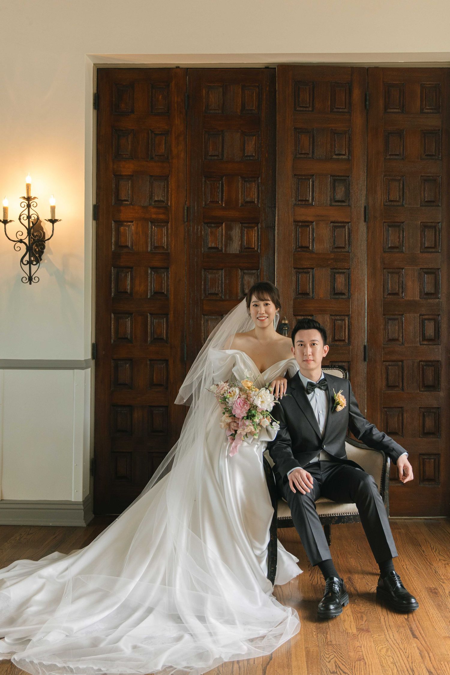 Wedding portraits against wooden paneled walls with elegant poses and formal attire.