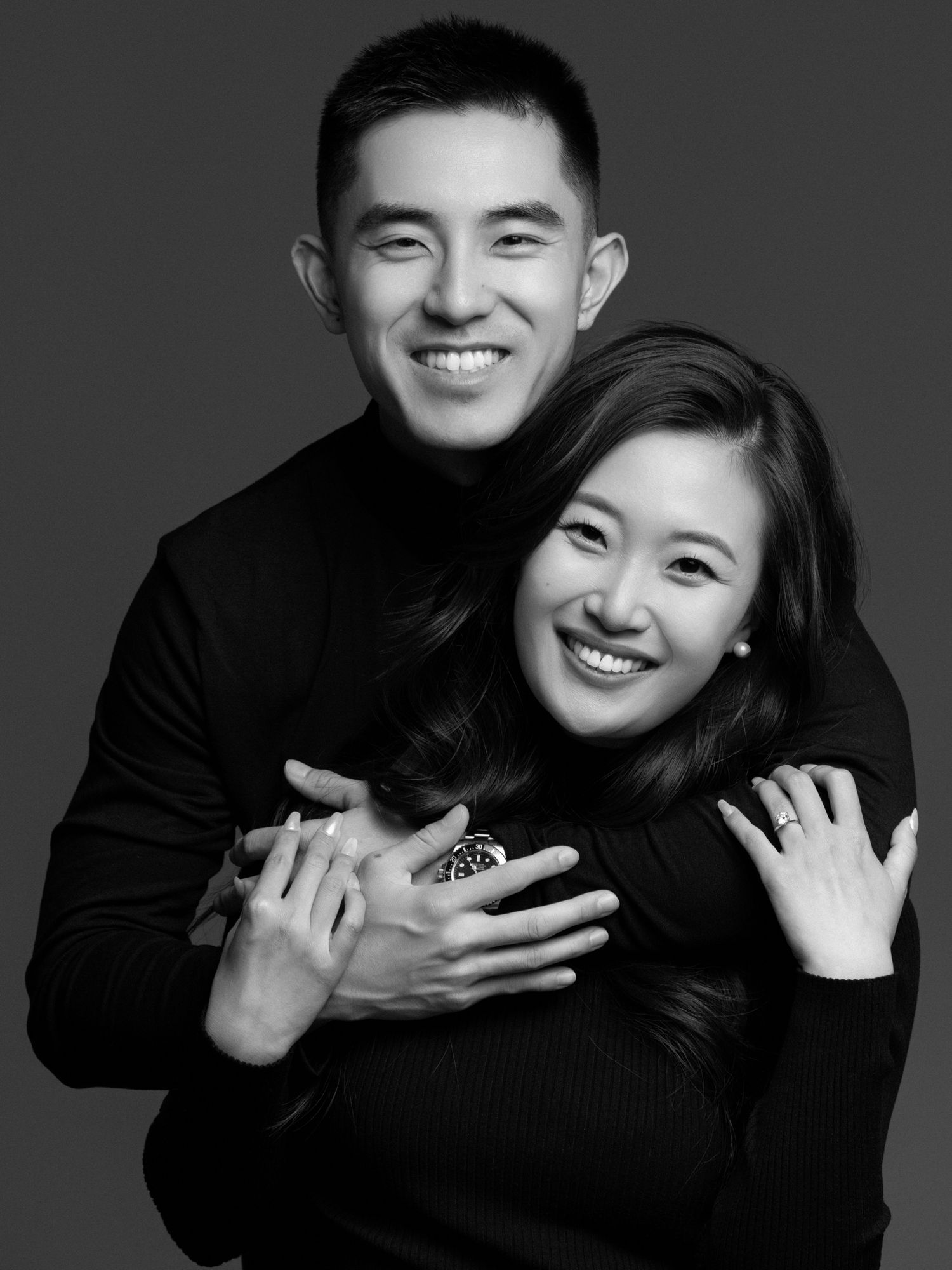 Intimate black and white portraits showing warm interactions and smiles.