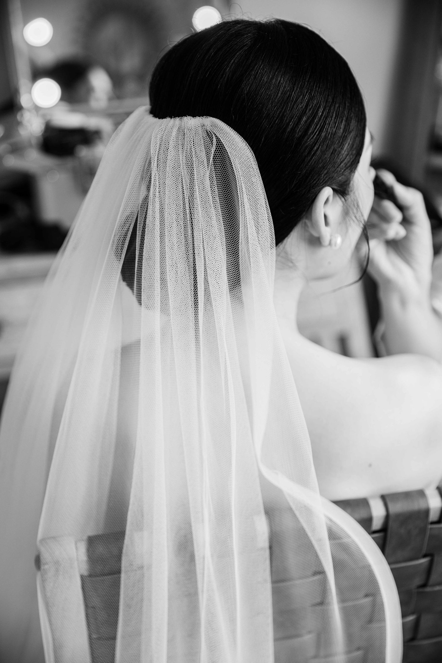 Black and white detail shots of bridal veil and hairstyle.