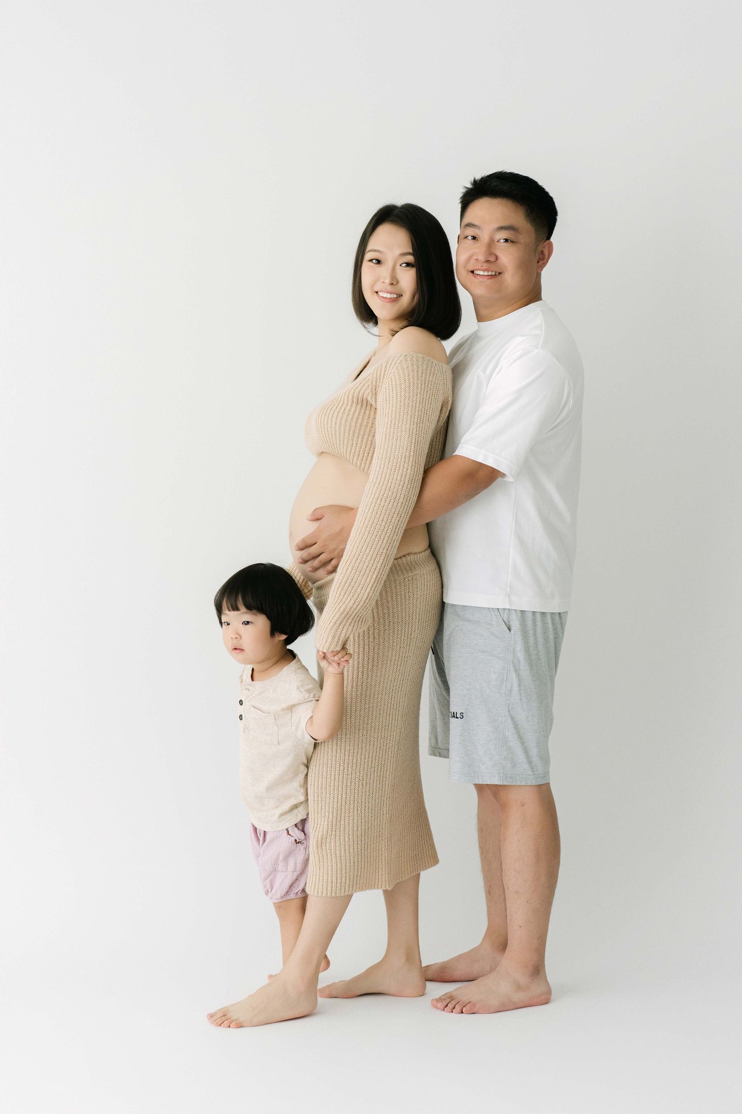 Simple family maternity portraits showing loving connections.