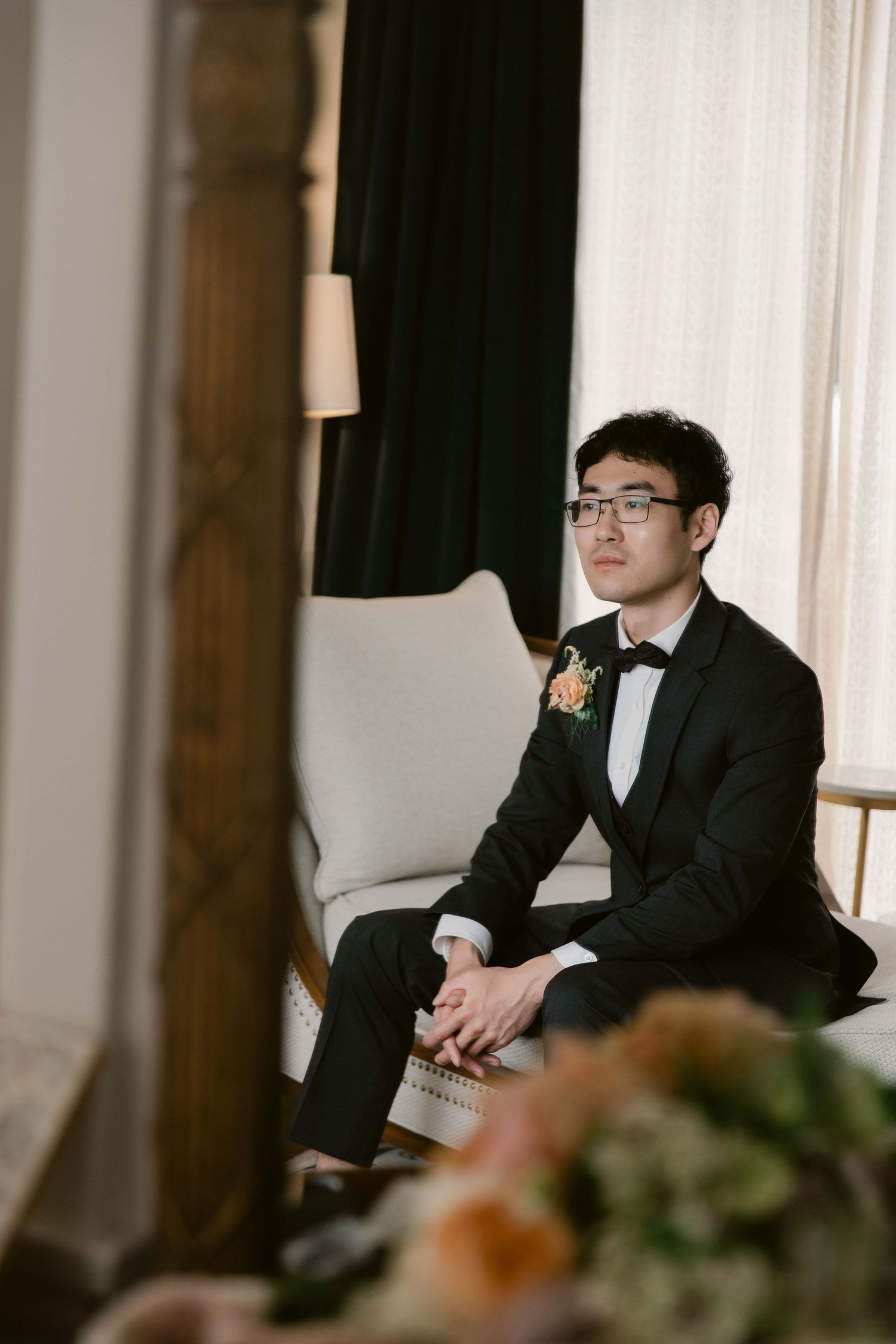 Wedding reception venue with elegant dark wood paneling and formal seating arrangements.