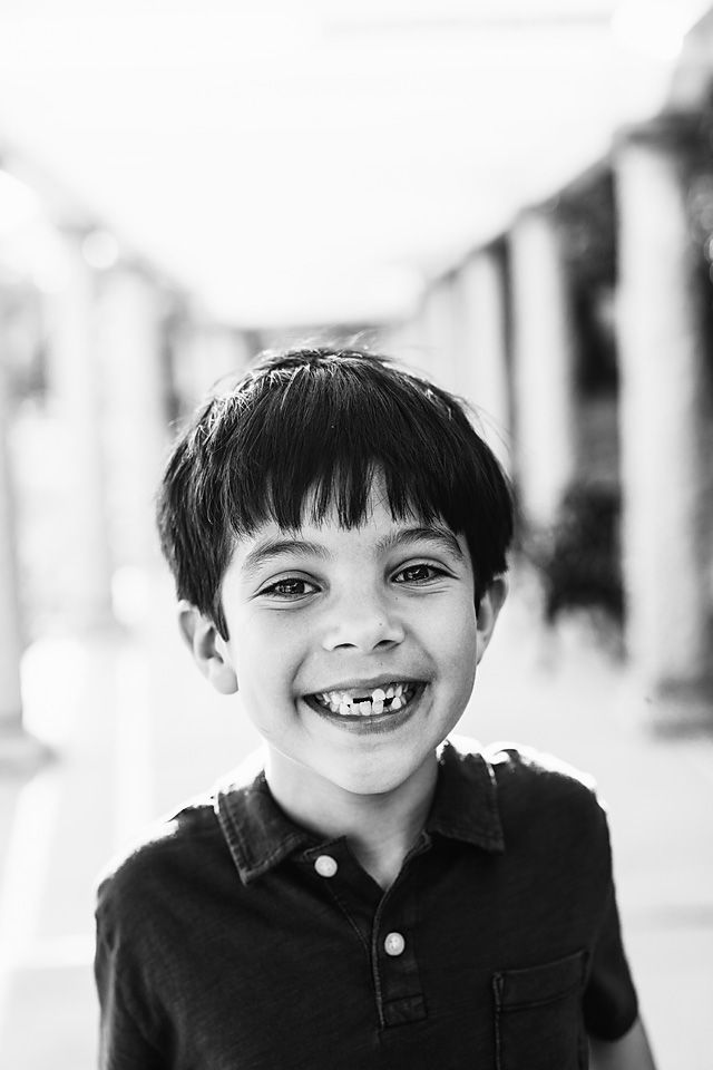 Joyful boy with missing teeth smiling in black and white Richmond family photographer, midlothian, glen Allen, short pump