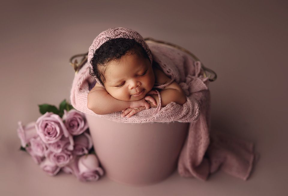 Sleeping newborn baby in pink bucket with roses baby photographer Richmond Chesterfield midlothian Petersburg glen Allen short pump