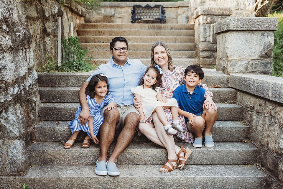 Family of five sitting on stone steps smiling together.
Richmond family photographer, midlothian, glen Allen, short pump