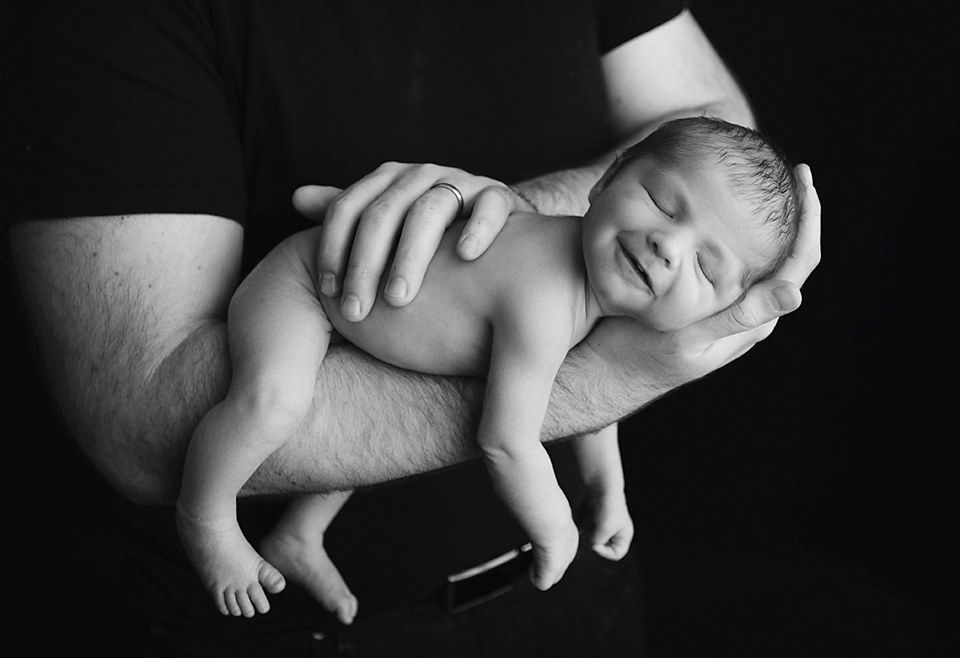 Black and white photo of a smiling newborn baby newborn photographer Richmond Chesterfield midlothian Petersburg glen Allen short pump