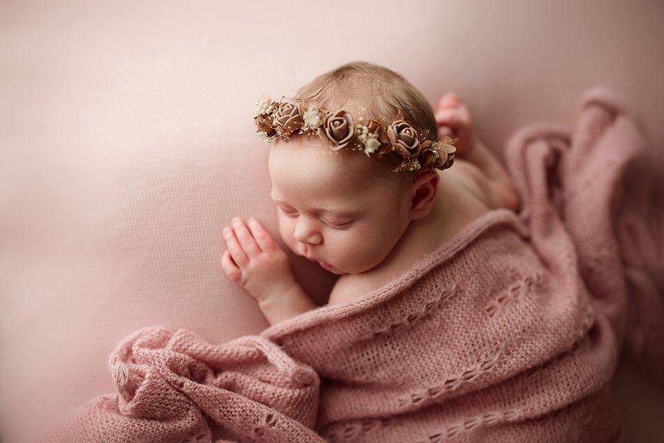Sleeping newborn baby girl with floral crown on pink knit blanket newborn photographer Richmond Chesterfield midlothian Petersburg