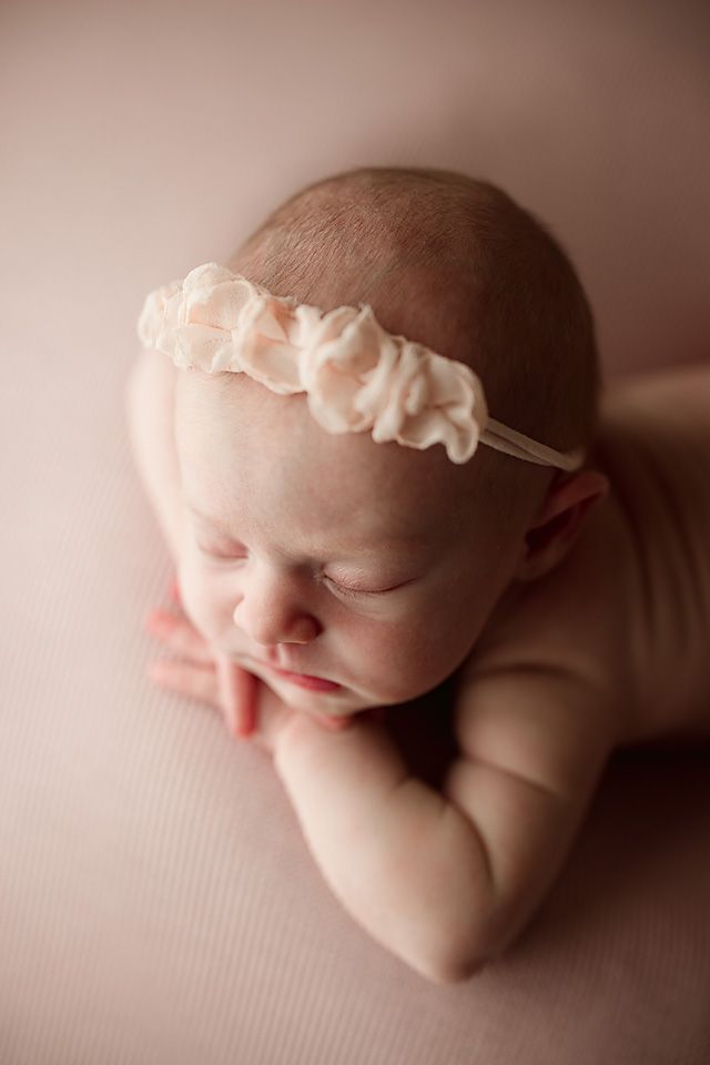 Sleeping newborn baby girl wearing a soft pink floral newborn photographer Richmond Chesterfield midlothian Petersburg glen Allen short pump
