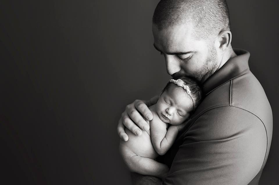 Father cradling sleeping newborn baby in black and  portraitnewborn photographer Richmond Chesterfield midlothian Petersburg glen Allen shor