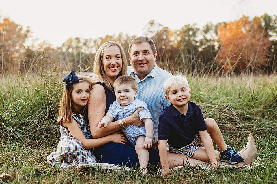 Happy family of five sitting together in a sunny autumn meadow. Richmond VA family photography. Midlothian, Petersburg, Glen Allen