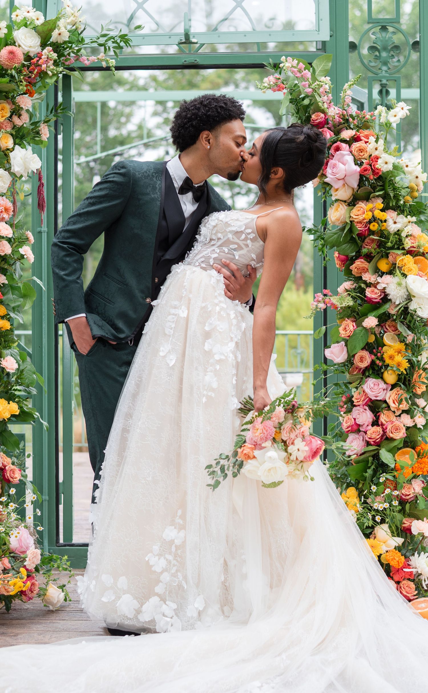 A Maryland wedding couple sharing a passionate kiss while showing off their summer vibrant colors
