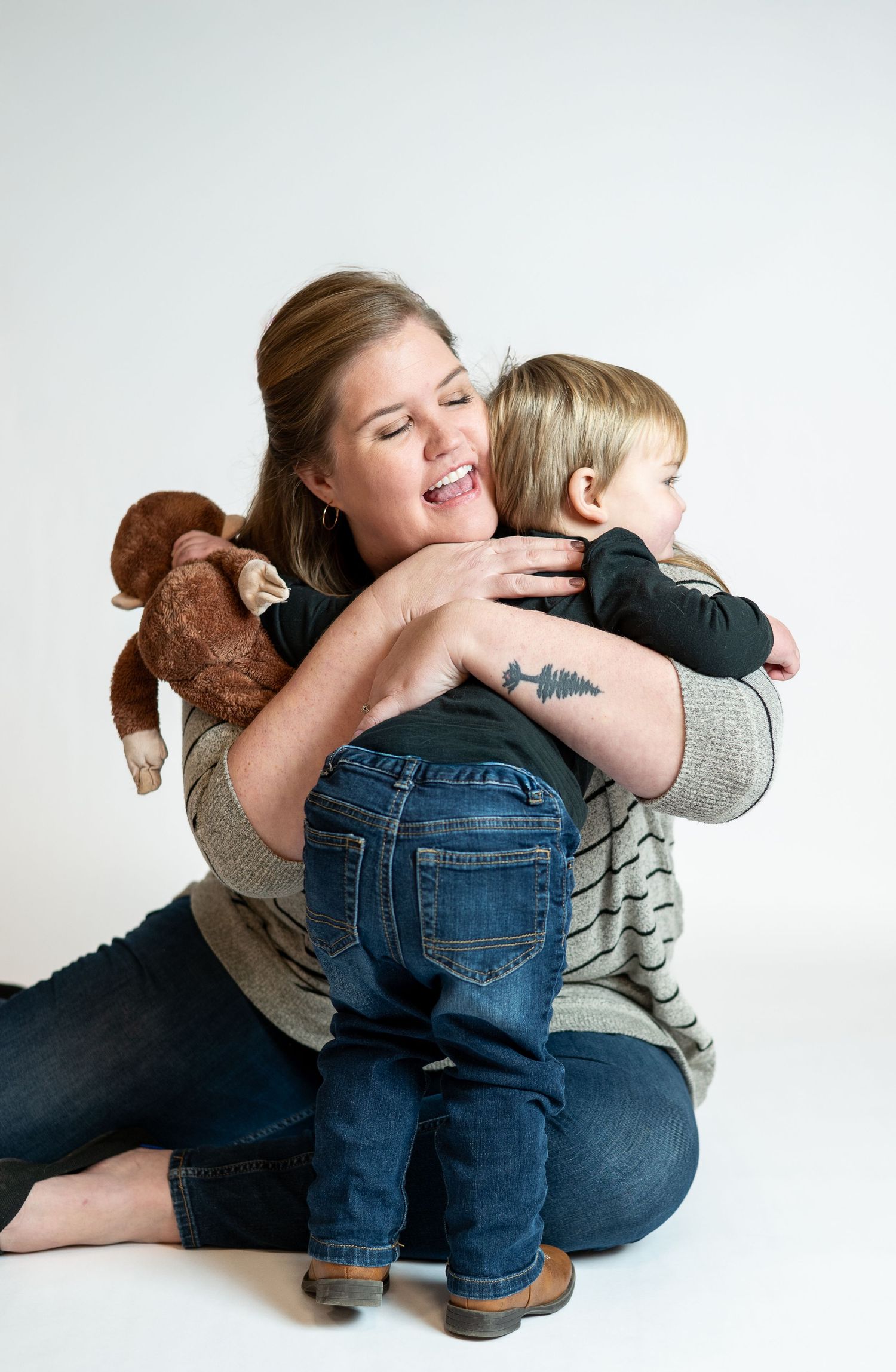 A heartwarming series of candid moments showing tender embraces and playful interactions between parent and child.