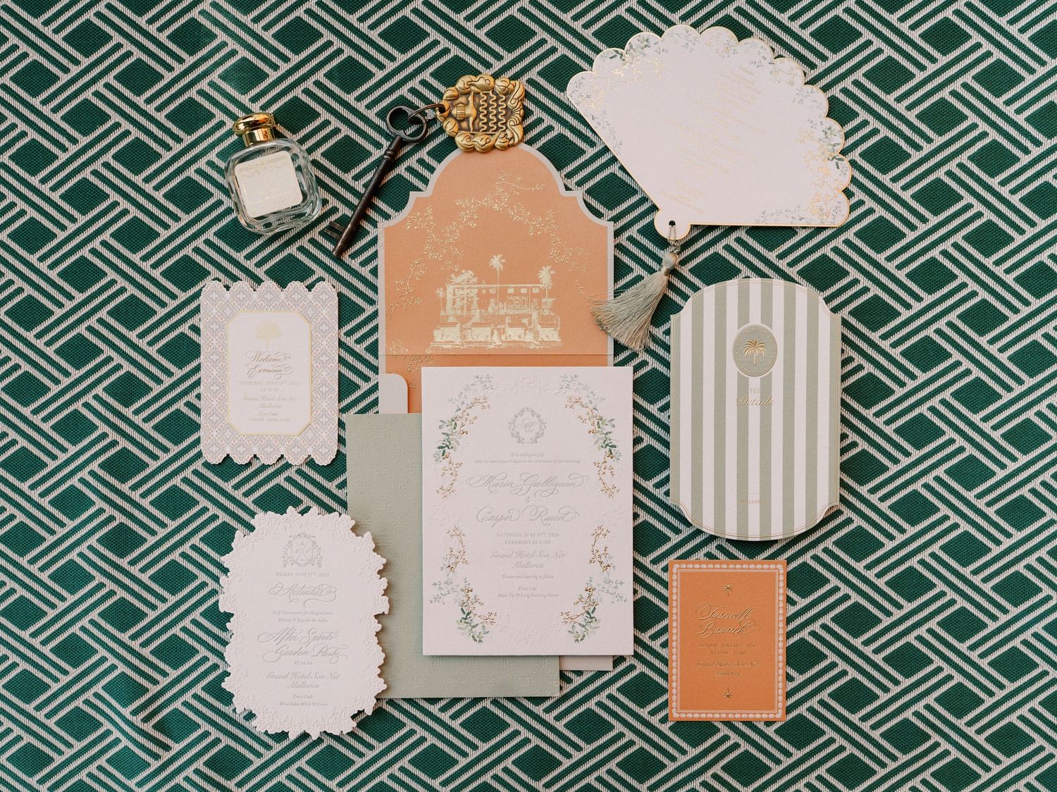 Elegant wedding invitation suite with sage green, peach, and white stationery on a green geometric patterned background.