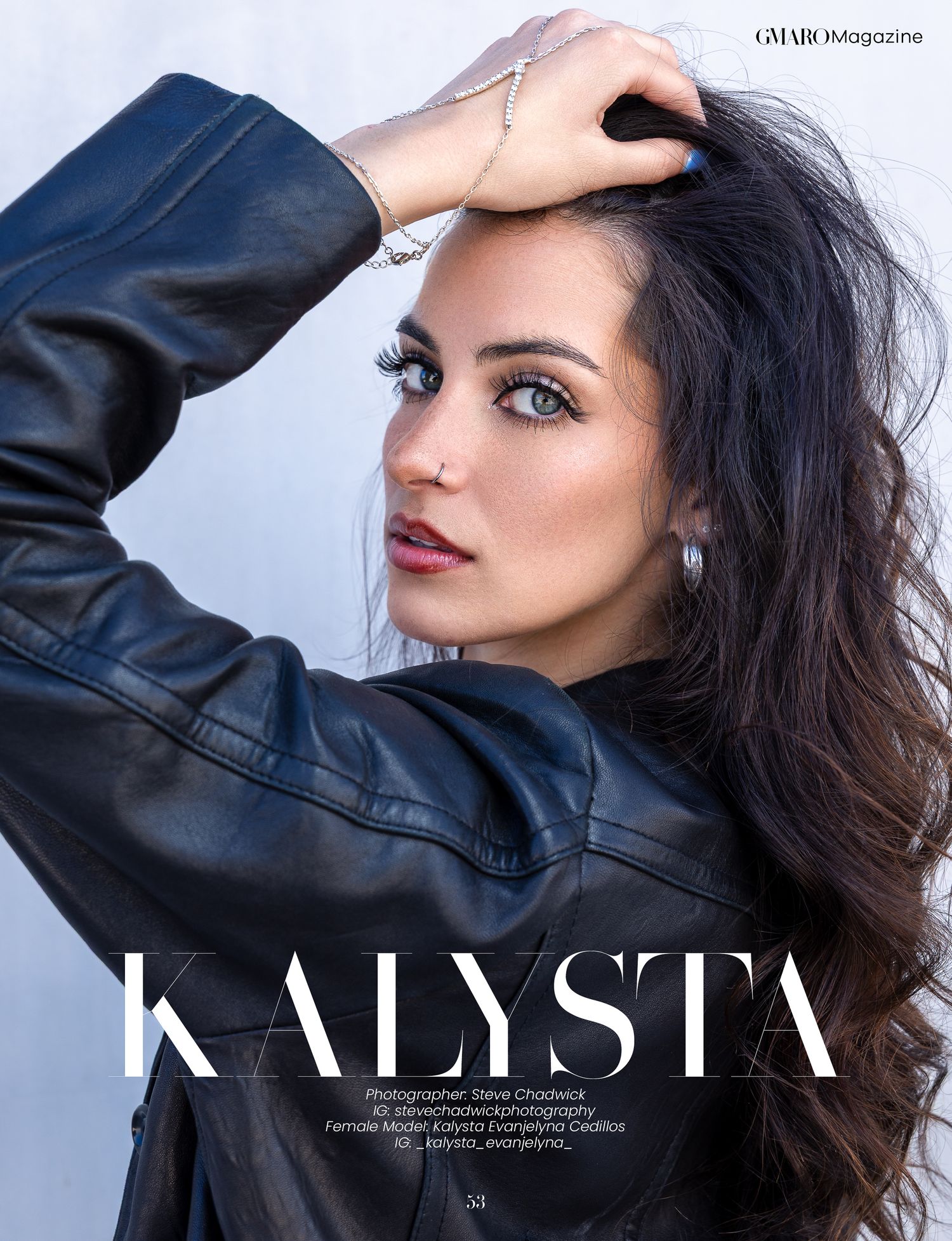 Dark-haired female model Kalysta poses dramatically in a black leather jacket against a white background.
