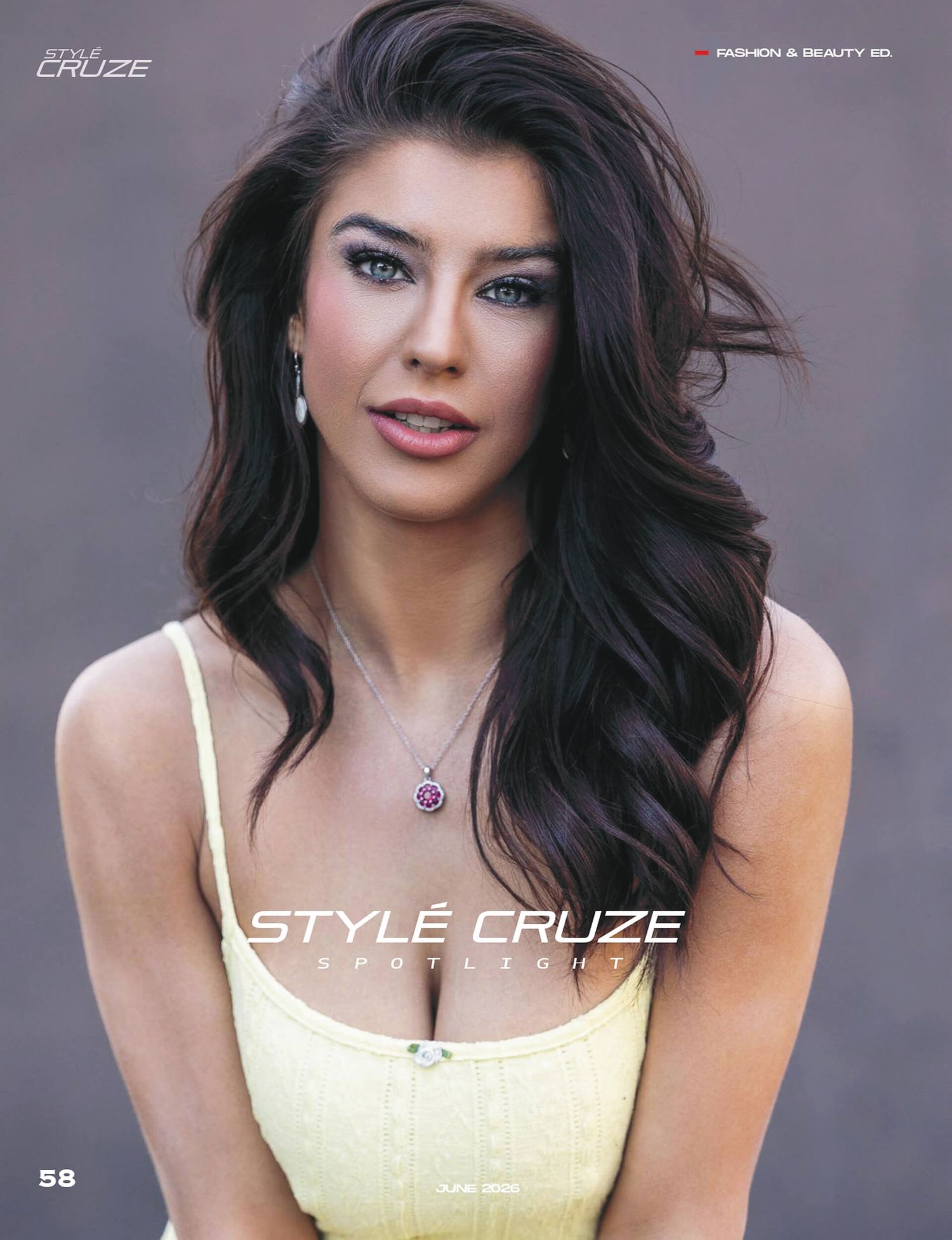 Woman with dark hair and blue eyes poses for Style Cruze magazine fashion and beauty editorial in yellow top.