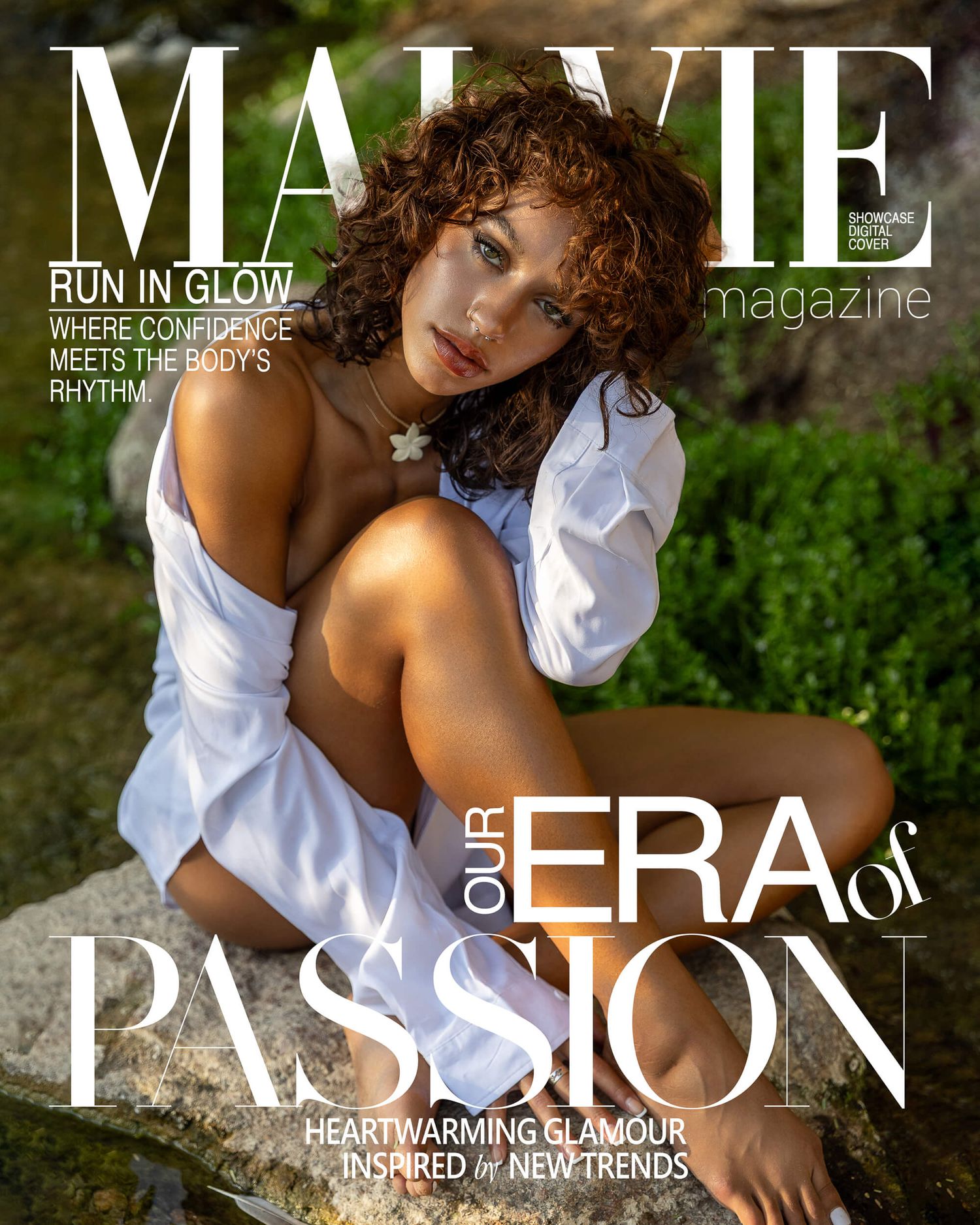 Woman in white off-shoulder dress sits on rocks for MALVIE Magazine Era of Passion glamour cover.