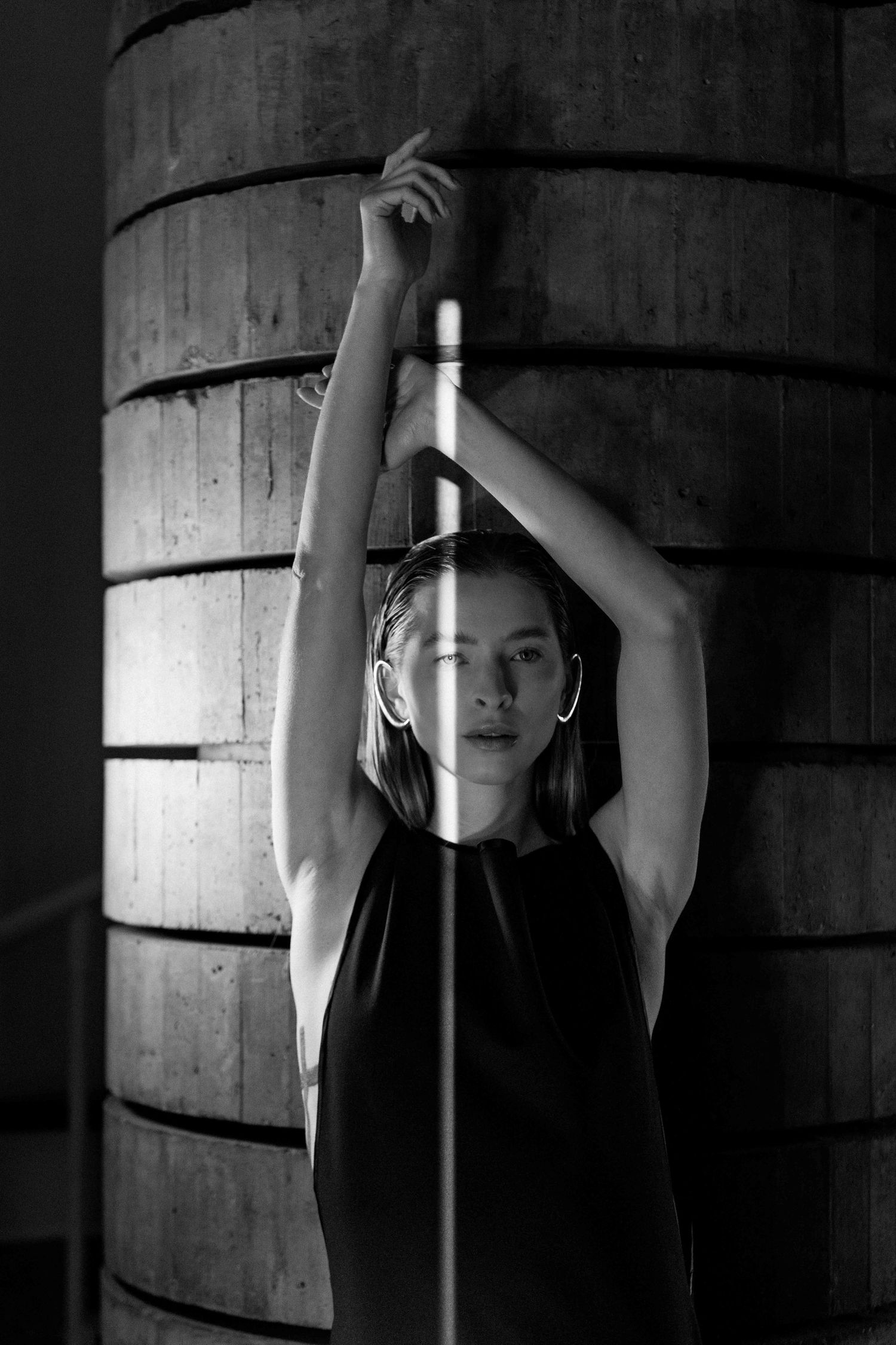 Fashion portrait with model with cement column
