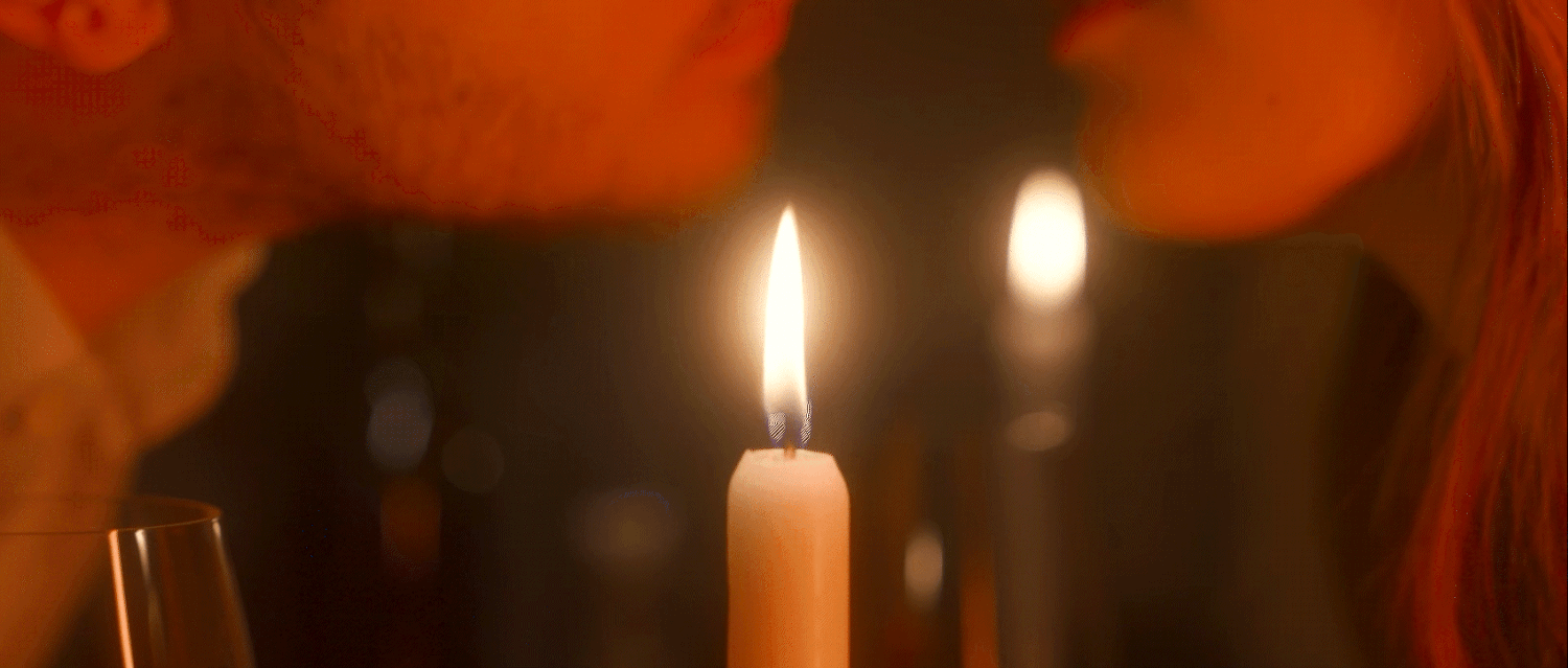 Romantic candlelit scene captured with cinematic lighting for a luxury lifestyle commercial.